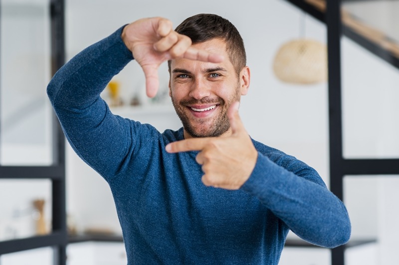 playful man smiling camera