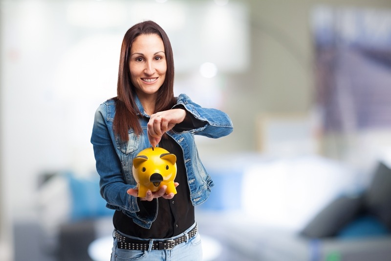 woman with yellow piggy bank